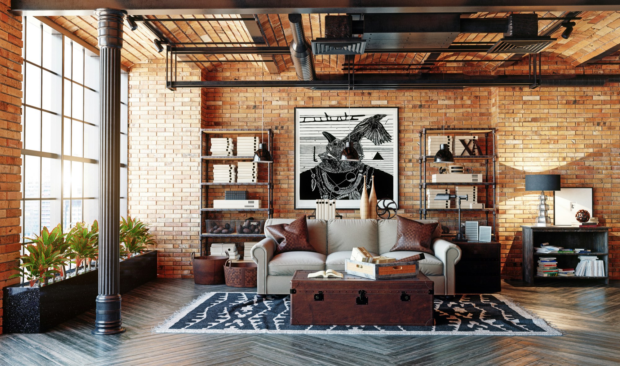 A brick and beam loft with a leather sofa, a rug and art on the walls